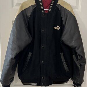 Puma Letterman Jacket with leather sleeves and red lining.  Size Medium